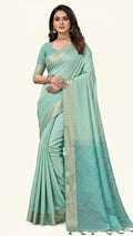 Woman wearing a light blue saree with a white background